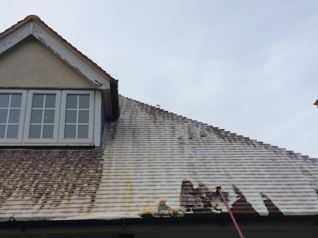 Code 3 Cleaning roof washing service in progress